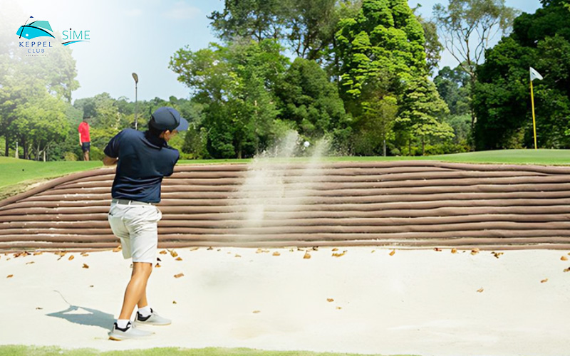 Golfers Hit The Ball In The Sand