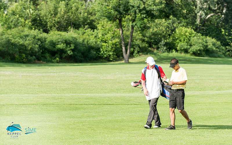 Two Man Golfer Walking And Talking