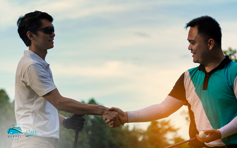 Men golfer shaking hand after finish the game at golf course