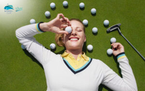 Happy-woman-with-golf-balls-promoting-FoS-Power-rewards