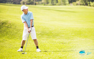 Senior-Golfer-on-Putting-Green-About-To-Take-The-Shot