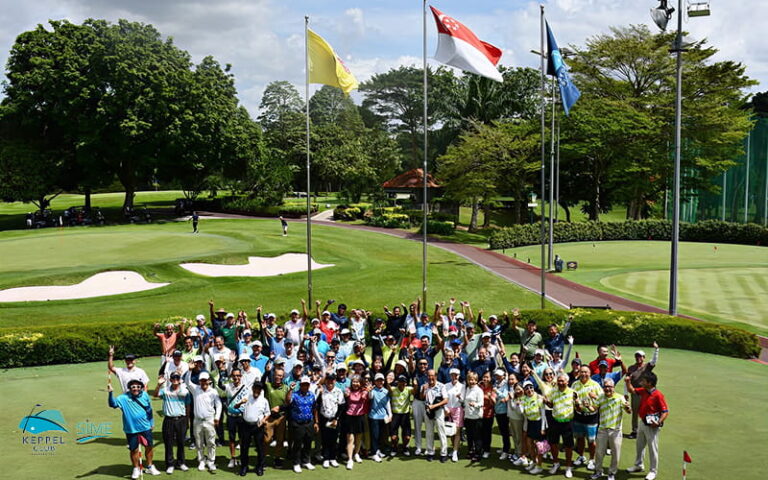 Golfers posing for a group photo at Sime Course event